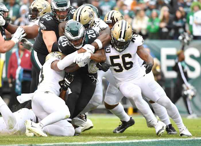Philadelphia running back Miles Sanders (26) is tackled by New Orleans Saints safety Marcus Williams (43), defensive tackle Josiah Bronson (91) and linebacker Demario Davis (56). Mandatory Credit: Eric Hartline-USA TODAY